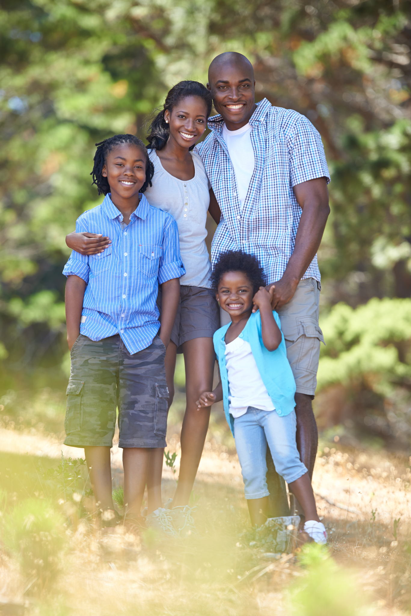 Family of 5 people hiking together on mountain trail - perfect family adventure